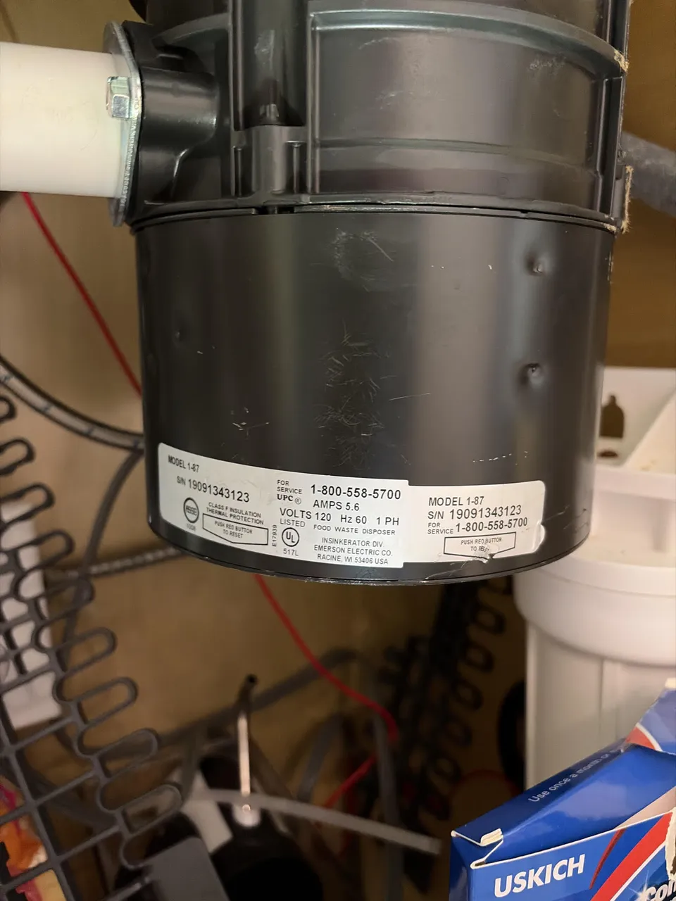 Garbage disposal unit installed under a kitchen sink