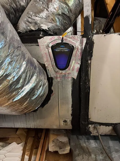 Whole-home air purification unit installed on ductwork