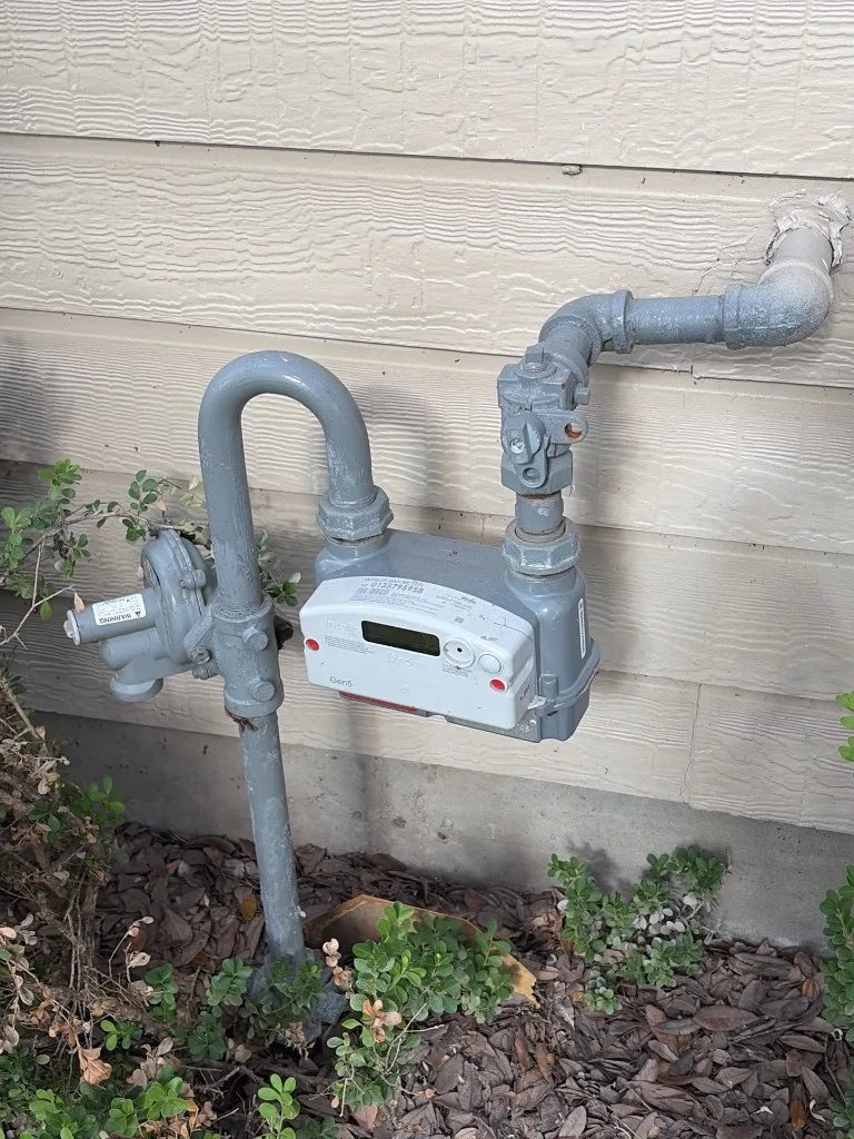 Residential natural gas meter and distribution piping