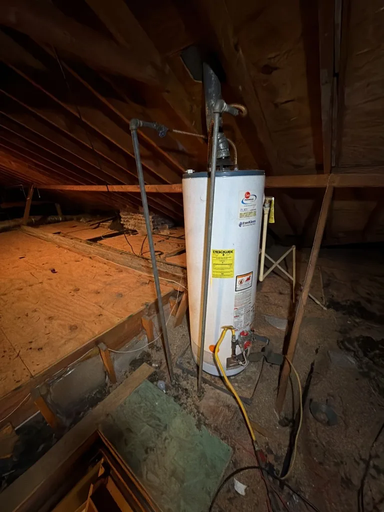 Gas water heater installed in an unfinished attic