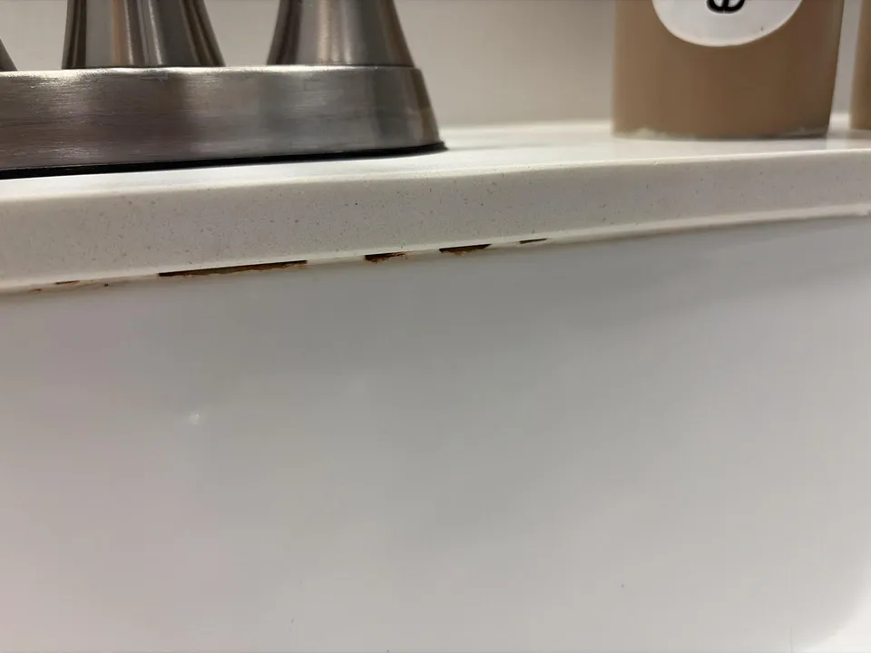 Staining at the seam between a sink and countertop