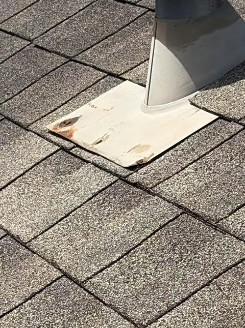 Attic vent flashing on a shingle roof