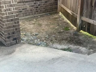 Drainage and grading condition at a foundation corner