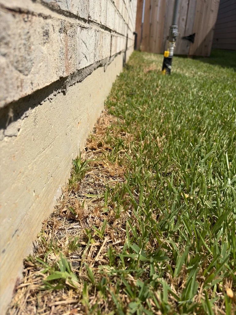 Grading and soil conditions along a foundation wall