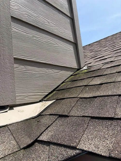 Roof flashing detail where siding meets shingles